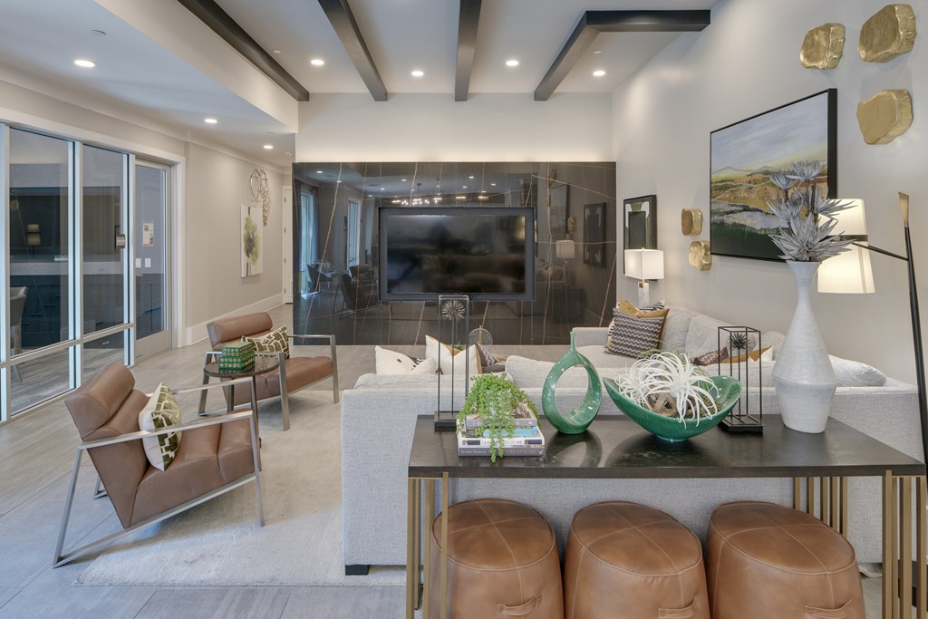 A modern living room with a fireplace and a dining table.