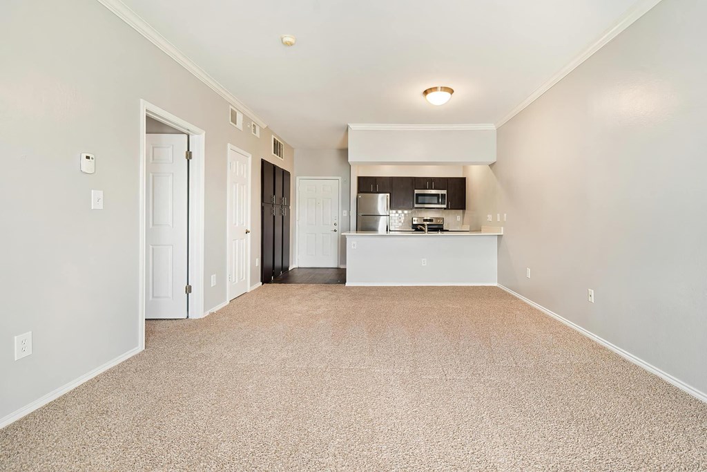 the living room and kitchen in a 555 waverly unit