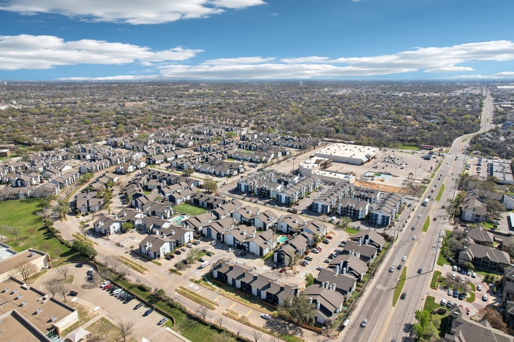A suburban area with a mix of residential and commercial buildings.