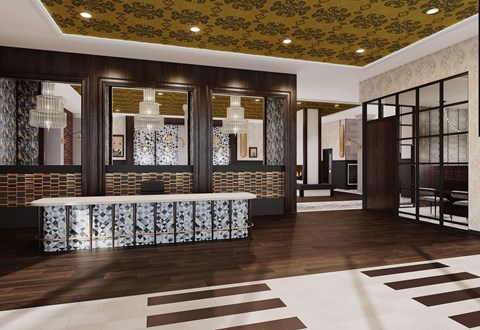 A reception area with a patterned carpet and a wooden floor.