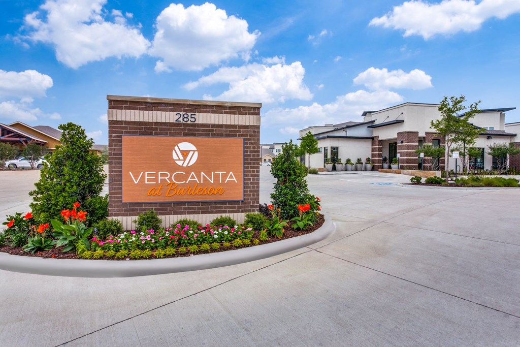 a large brick building with a sign that reads vercantia apartments