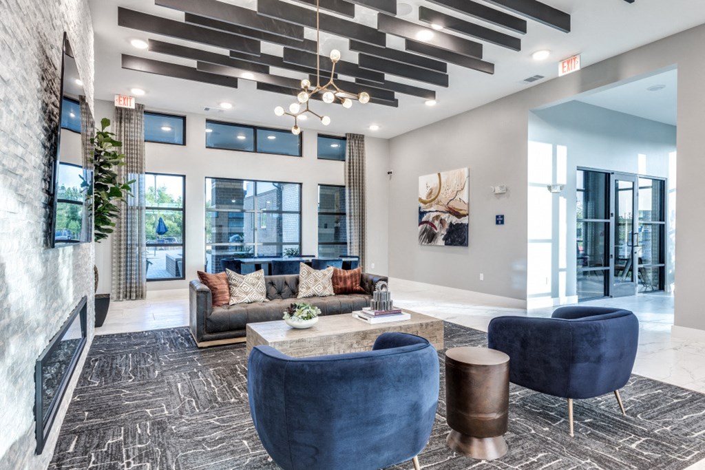 a living room with couches and chairs and a coffee table