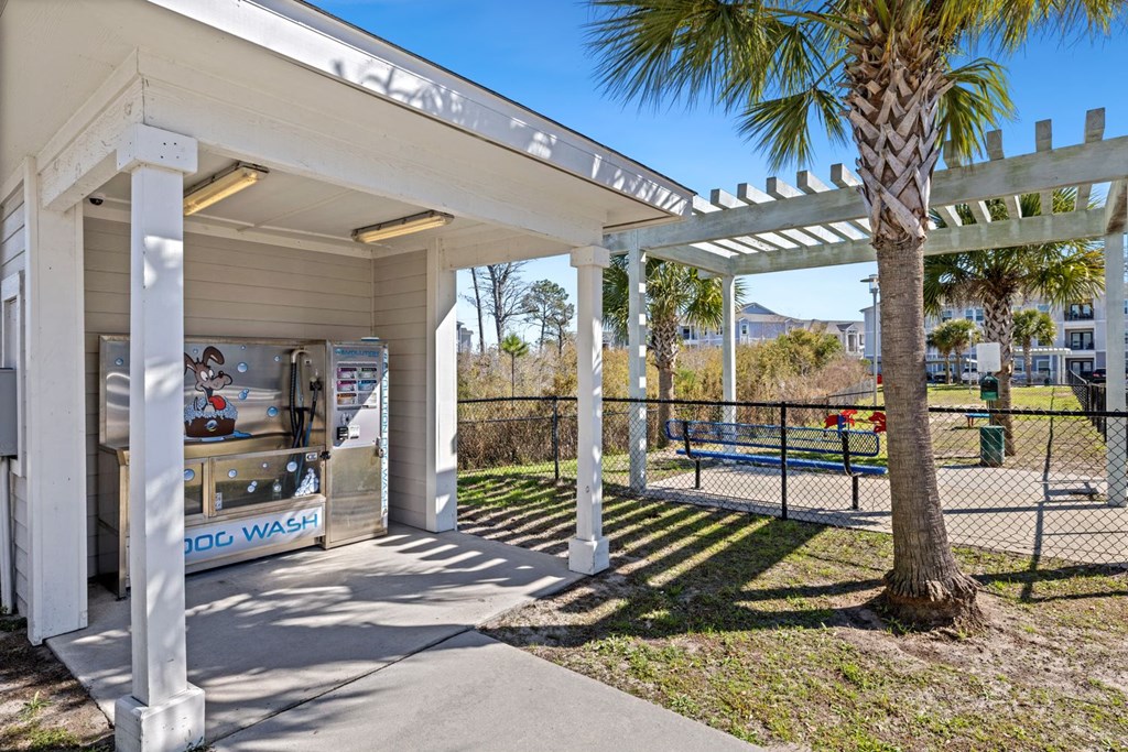 A white building with a sign that says