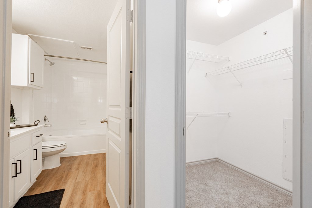 a small bathroom with a toilet and a sink and a shower