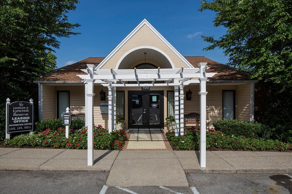 a building with a white awning and a parking meter in front of it