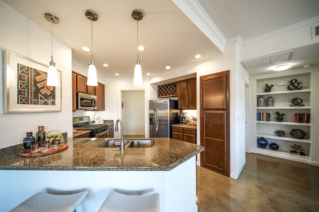 a kitchen with a granite counter top and a sink