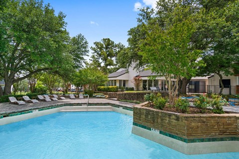 the swimming pool at the estates apartments