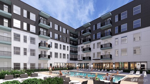 A large outdoor pool area with people relaxing and enjoying the sun.