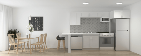 A kitchen with a dining table and chairs.