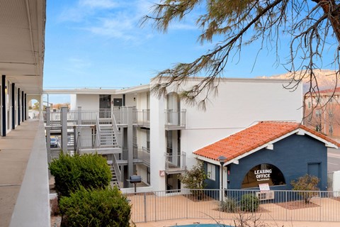 a building with a red roof and a blue and white building