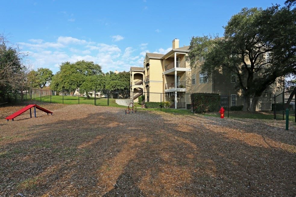 a playground in front of an apartment building