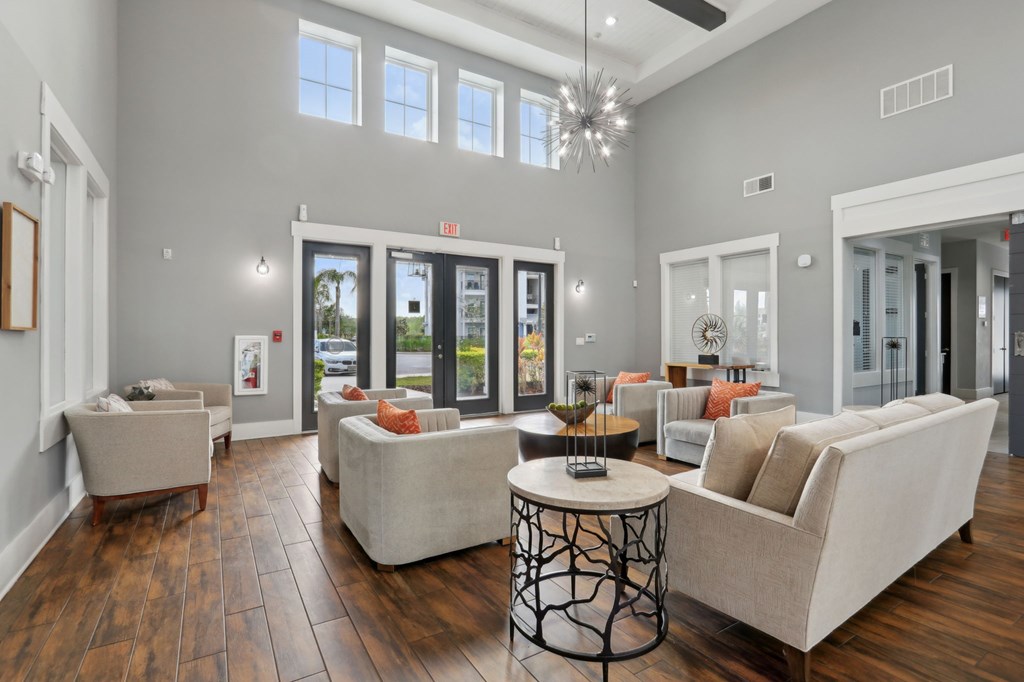 A living room with a white couch and a coffee table.