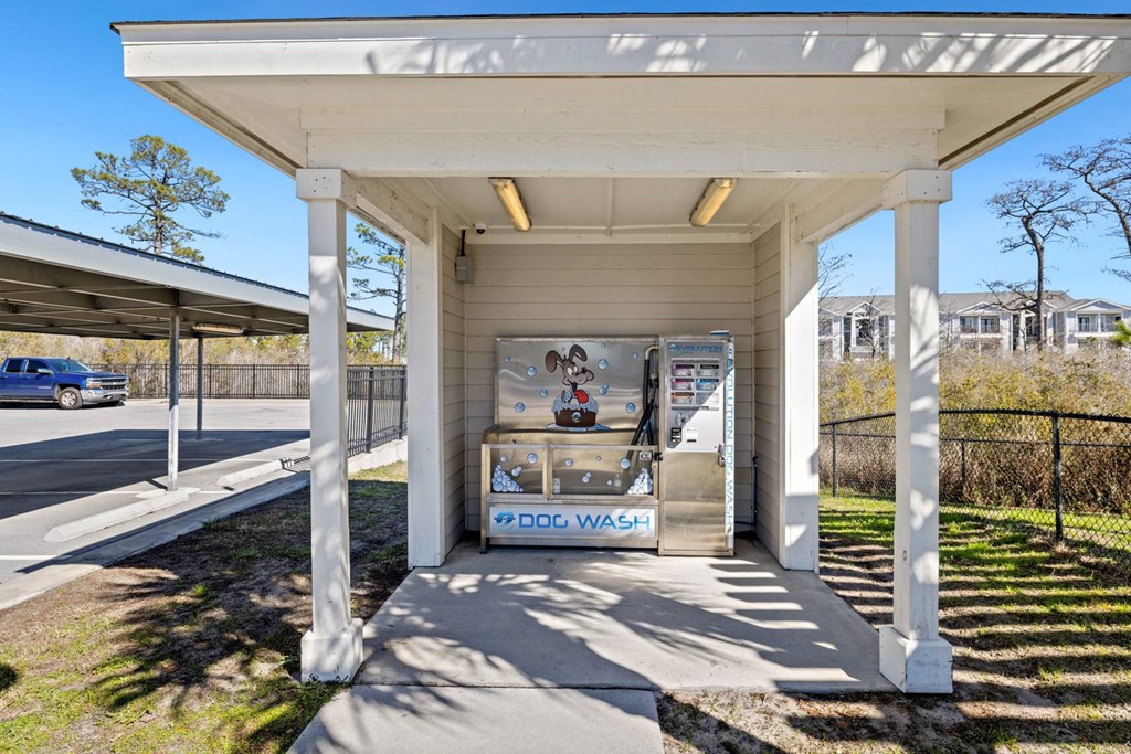 A car wash station with a sign that says
