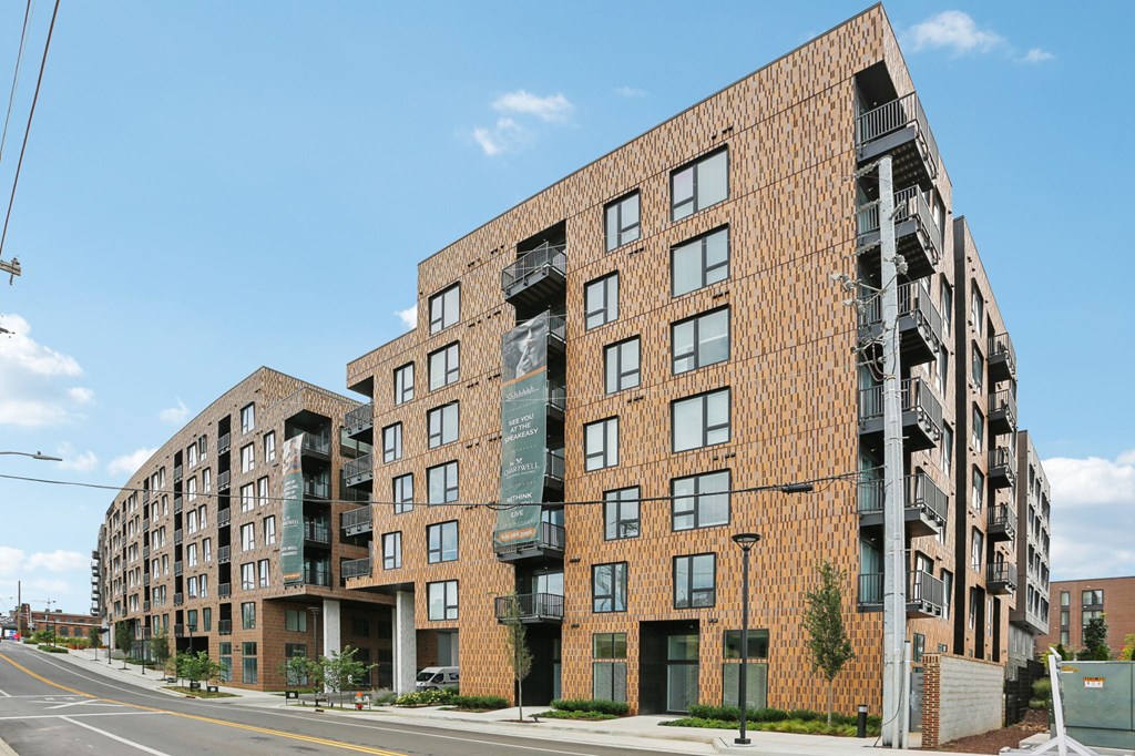 A large brick building with a balcony on the second floor.