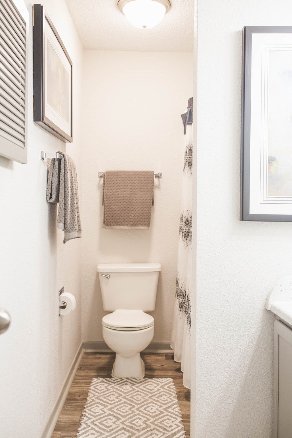 a small bathroom with a toilet and a window
