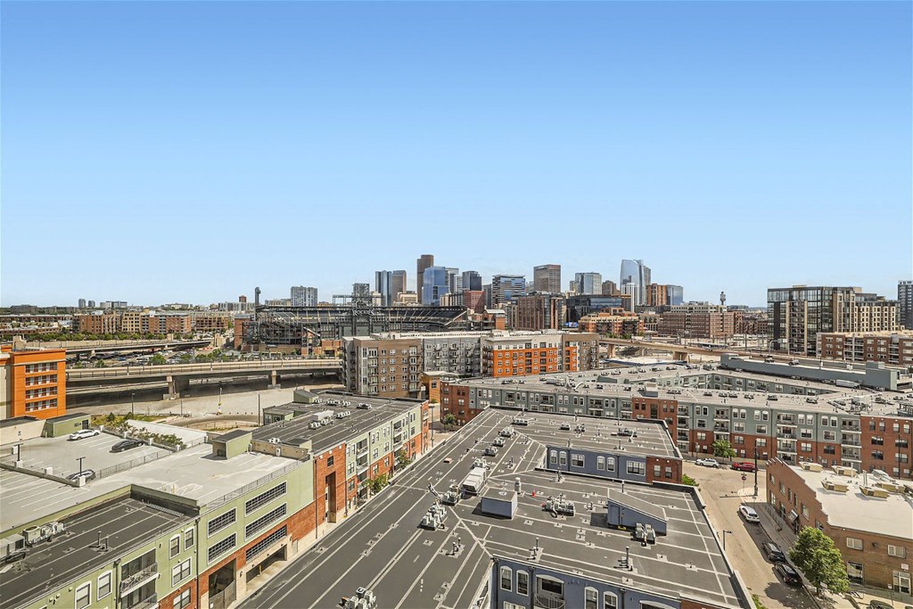 an aerial view of the city with traffic and buildings
