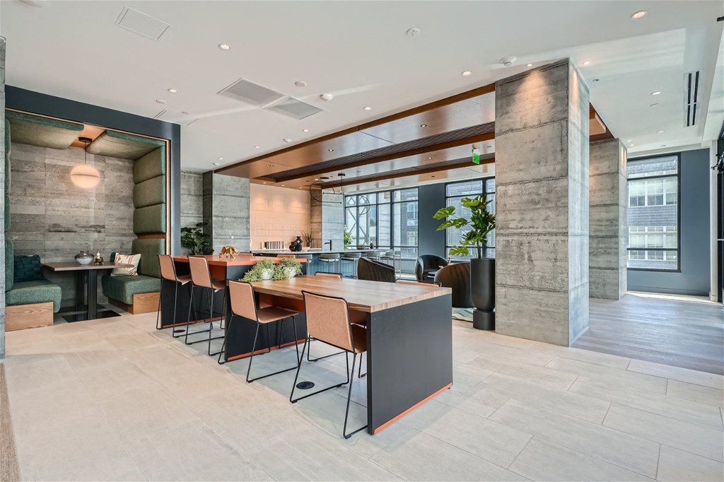 a large dining room with a long table and chairs
