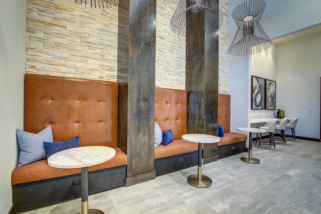 a seating area with couches and tables