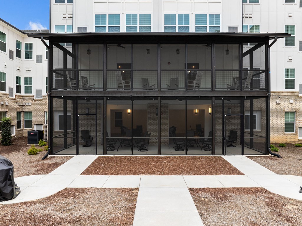 an office building with glass doors and a courtyard