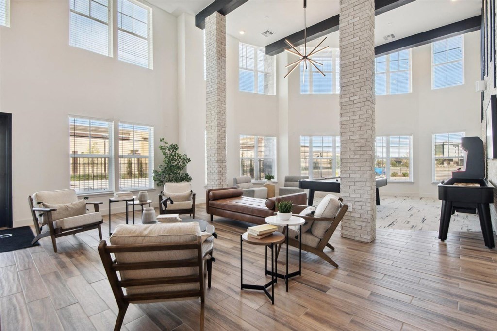 a large living room with furniture and a piano