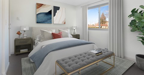 a bedroom with a bed and a window