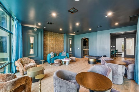 A room with a blue wall and a wooden table.