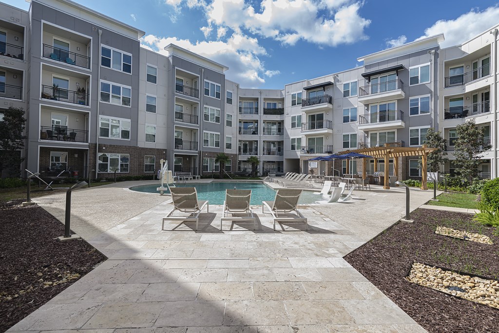 Relaxing pool with outdoor grilling area