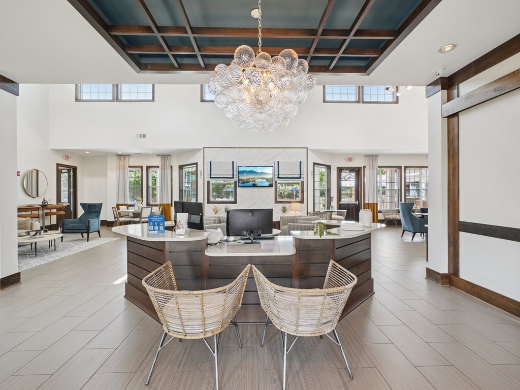 A reception area with a desk and two chairs.