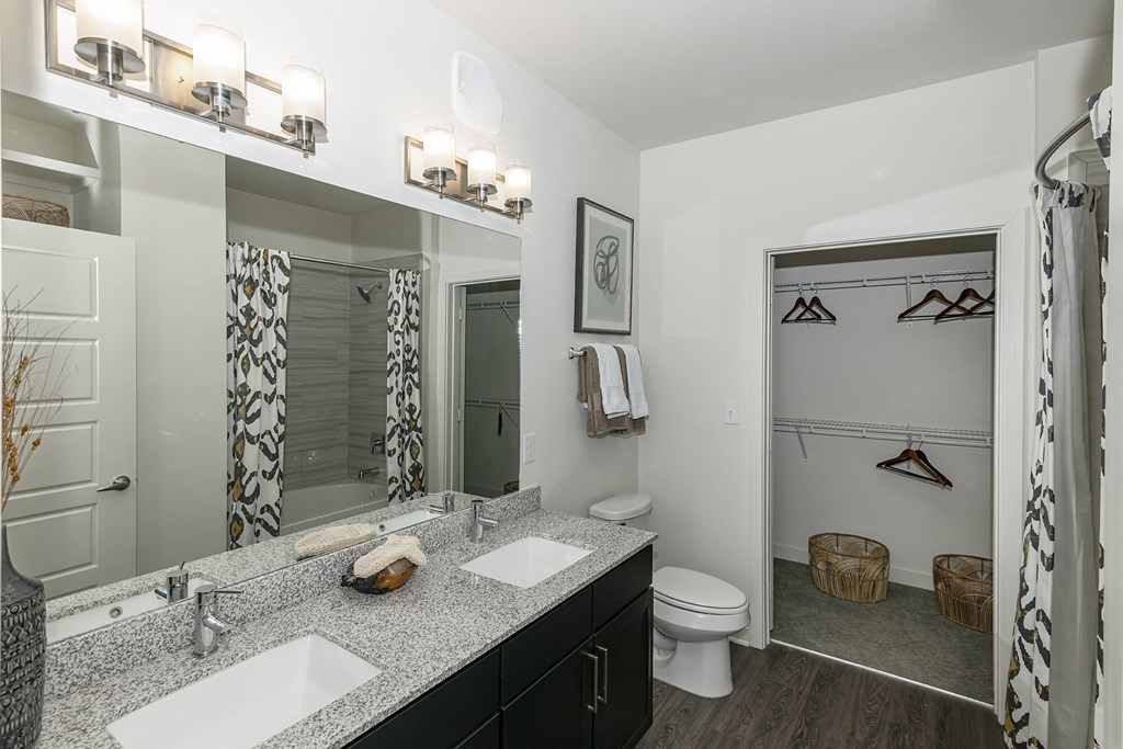 Bathrooms with dual vanities in select homes.