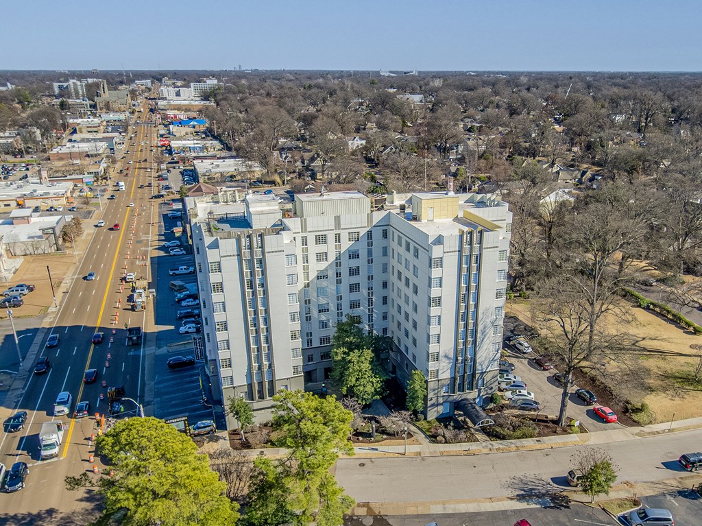 an aerial view of a city with tall buildings and trees