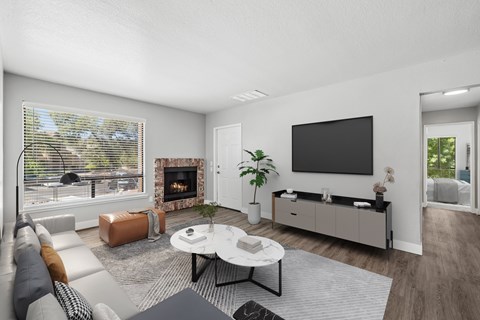 A modern living room with a fireplace and a flat screen TV.