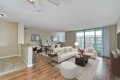 A living room with a white couch and a coffee table.