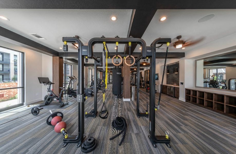 a gym with weights and cardio equipment in a home