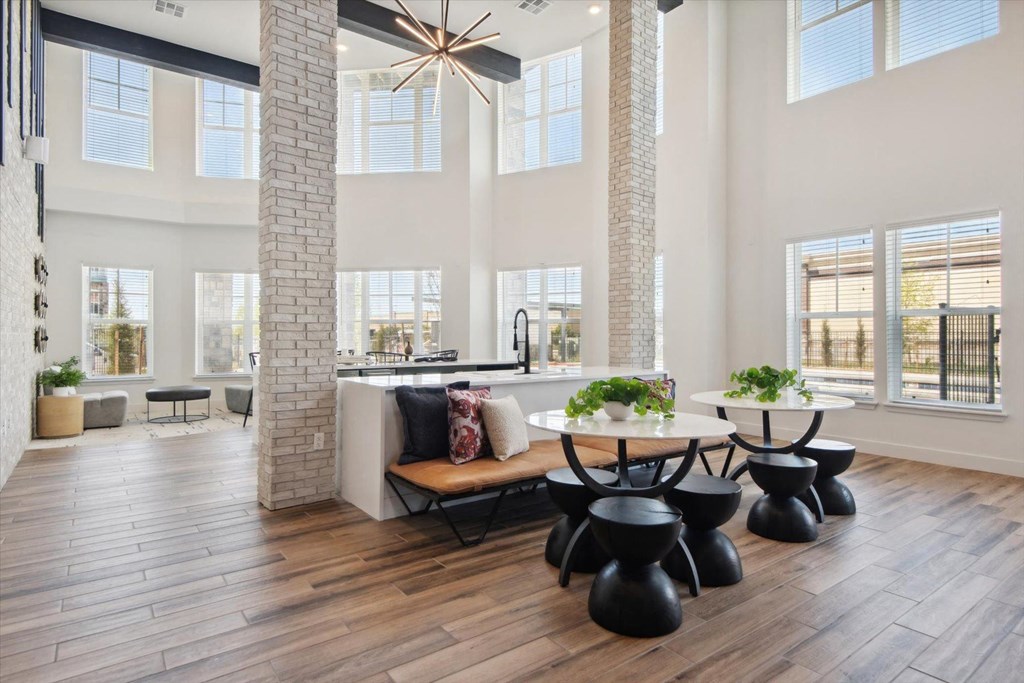 an open living room with a dining room and a kitchen