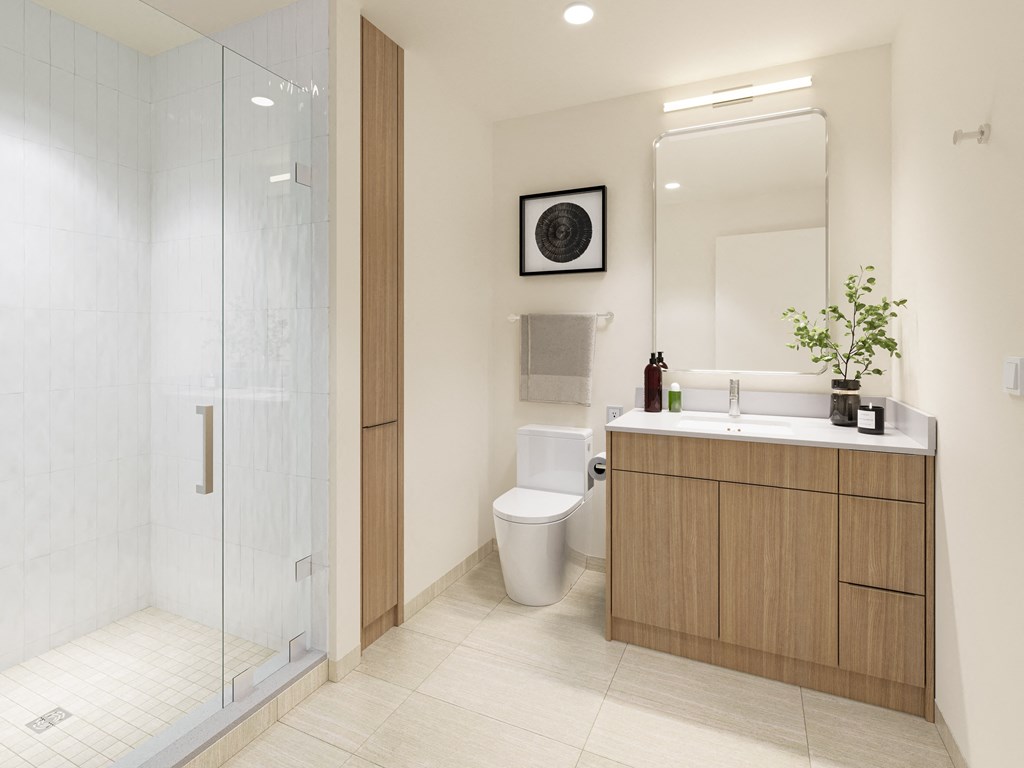 a bathroom with a toilet and a sink and a shower