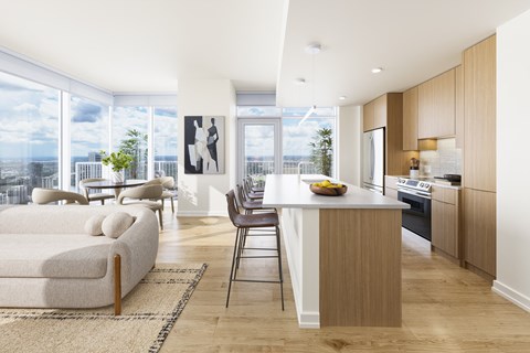 A modern kitchen with a dining table and chairs.