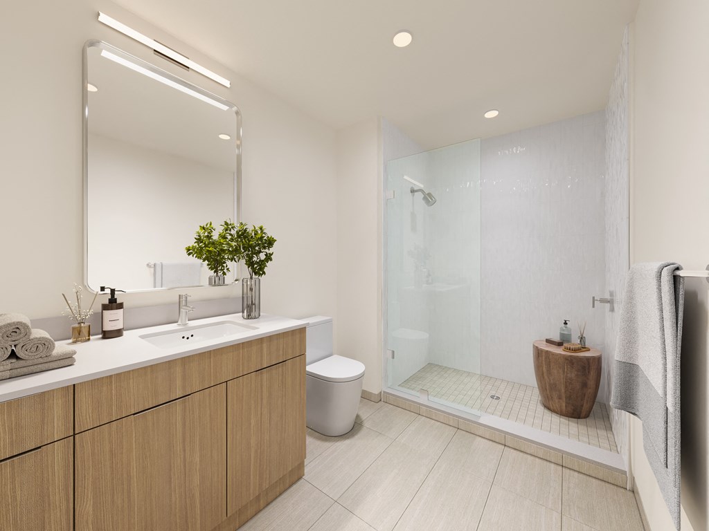 a bathroom with a toilet sink and a shower