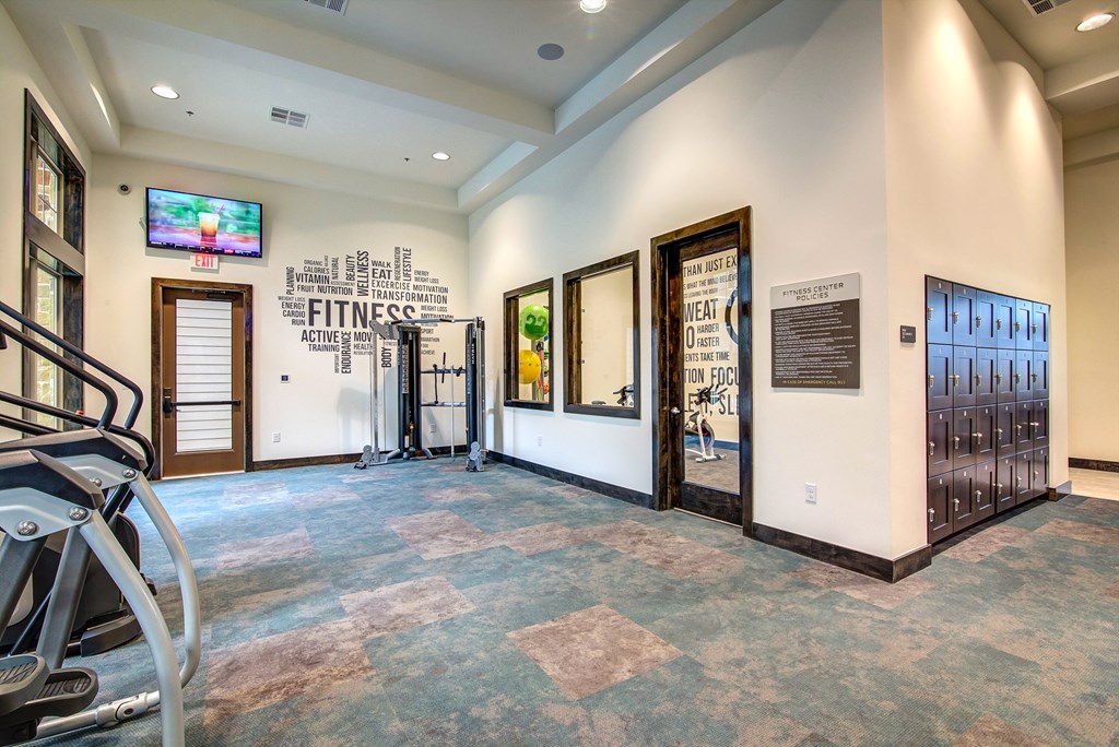 the gym at the enclave at woodbridge apartments in sugar land, tx