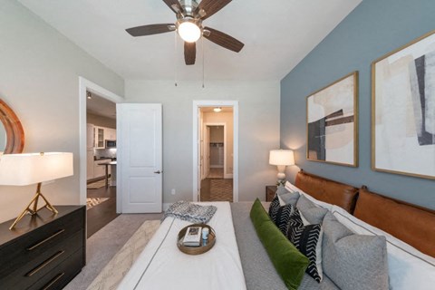 a living room with a couch and a ceiling fan