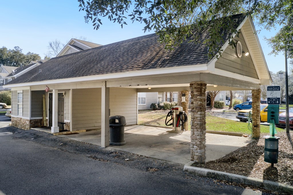 a gas station with a covered parking lot