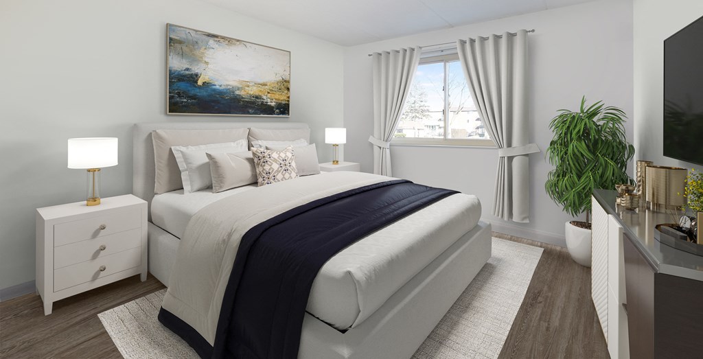 a white bedroom with a bed and a window