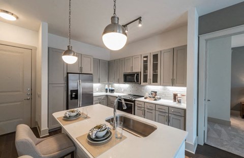 a kitchen with a sink and a counter top