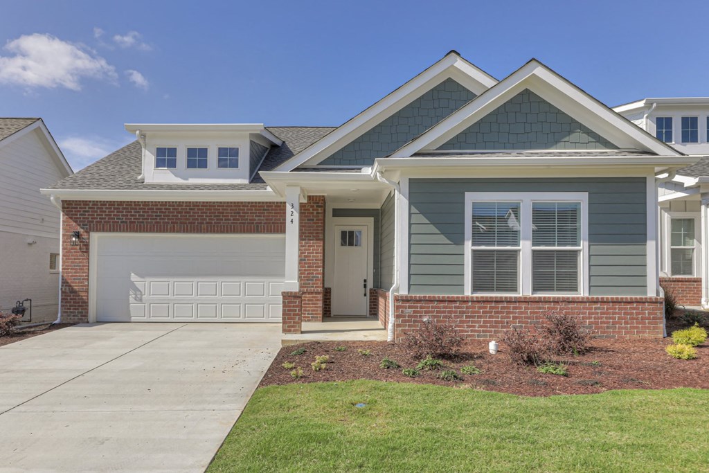 a house with a sidewalk in front of it