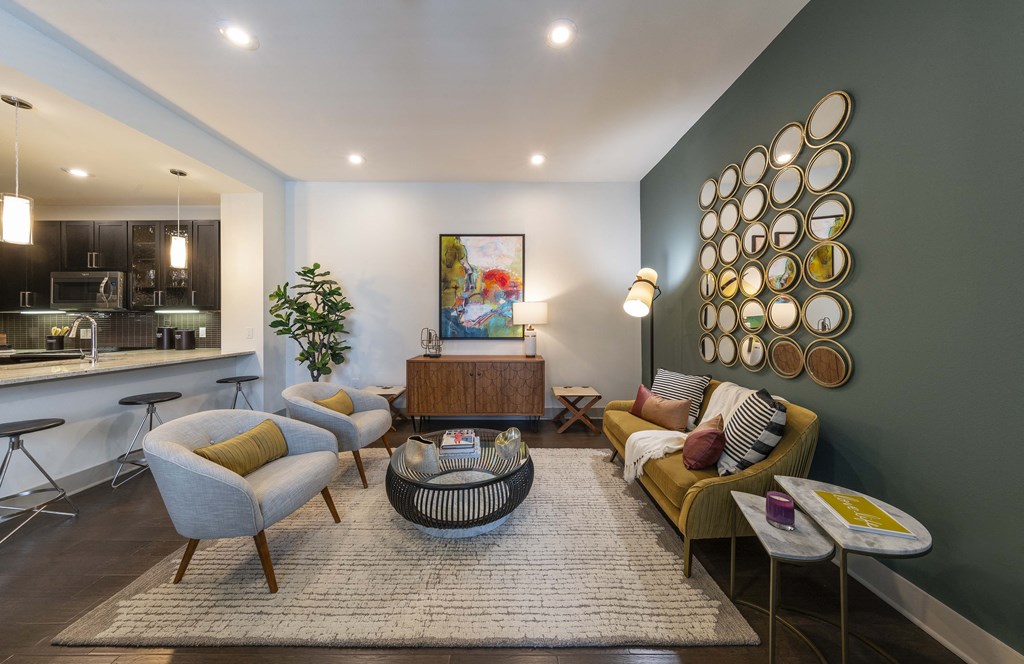 a living room filled with furniture and a large window