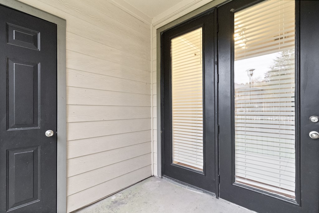 the front door of a home with black doors