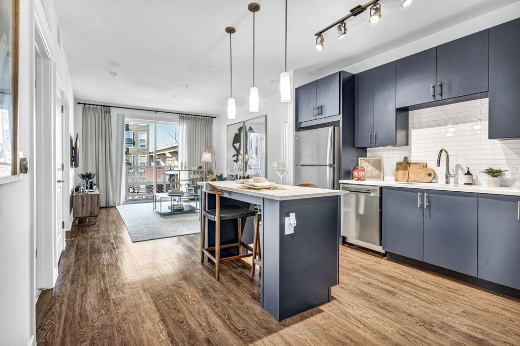 Navy blue kitchen style with stainless steel appliances