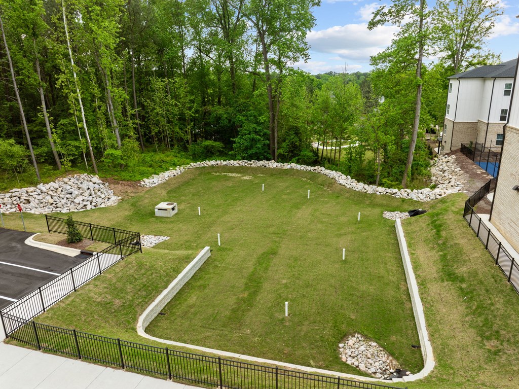 a yard with a soccer field in the middle of a house