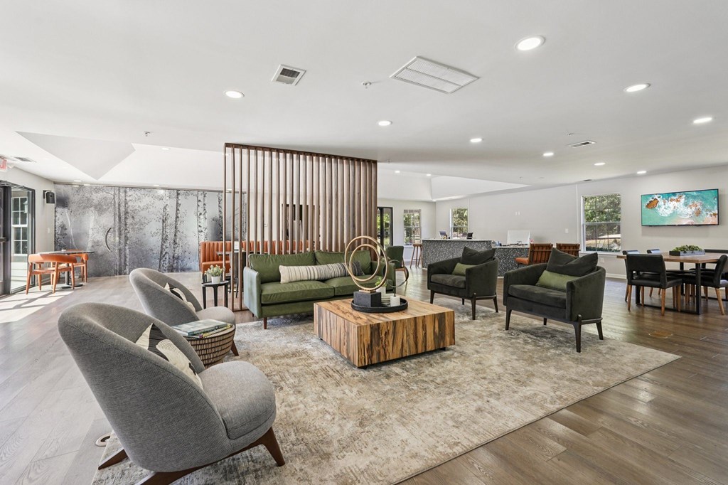 A living room with a grey sofa and a wooden coffee table.