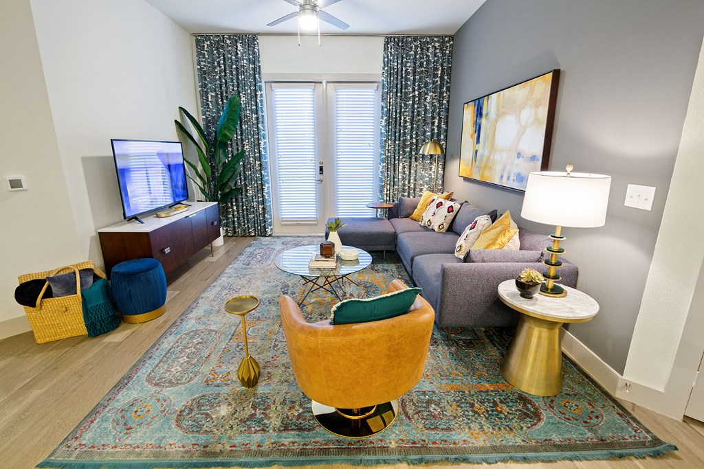 a living room with a couch and a tv