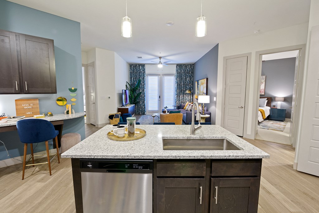 Open floor plan with kitchen island and dishwasher